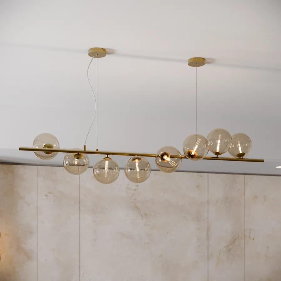 Lampada sospesa 145x33,5 cm in metallo oro con diffusori in vetro champagne