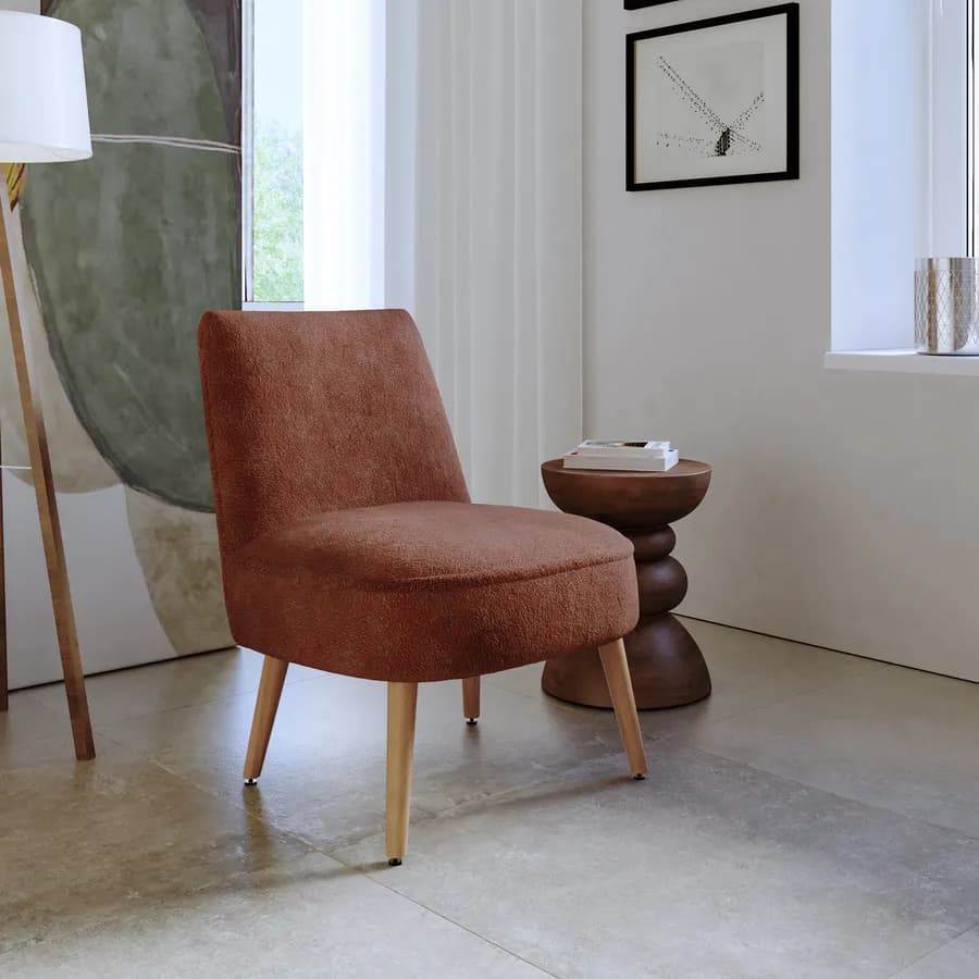 Poltrona in bouclé terracotta con gambe in legno - Dirla