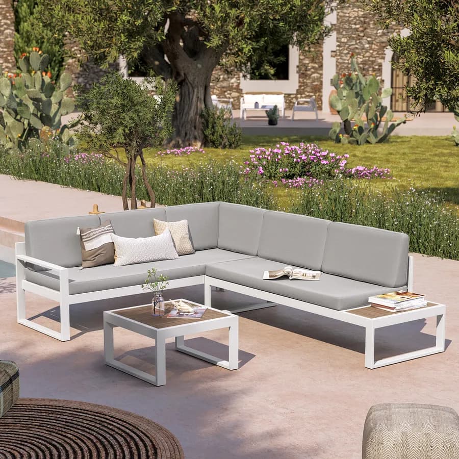 Set relax con divano angolare e tavolino in alluminio bianco con cuscini grigi - Kavos