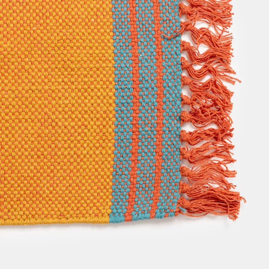 Tappeto 70x140 cm in cotone senape con frange