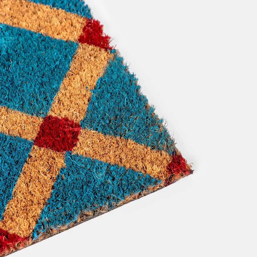 Zerbino blu petrolio 45x75 cm in coir naturale con disegno geometrico