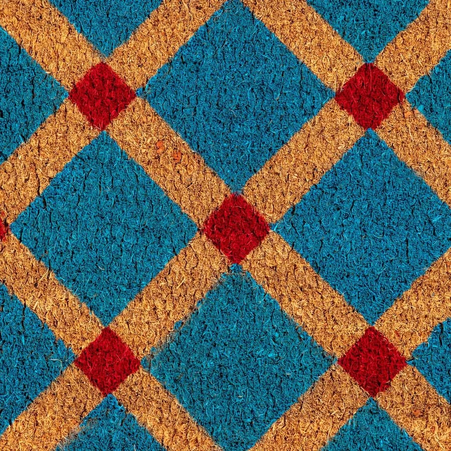 Zerbino blu petrolio 45x75 cm in coir naturale con disegno geometrico