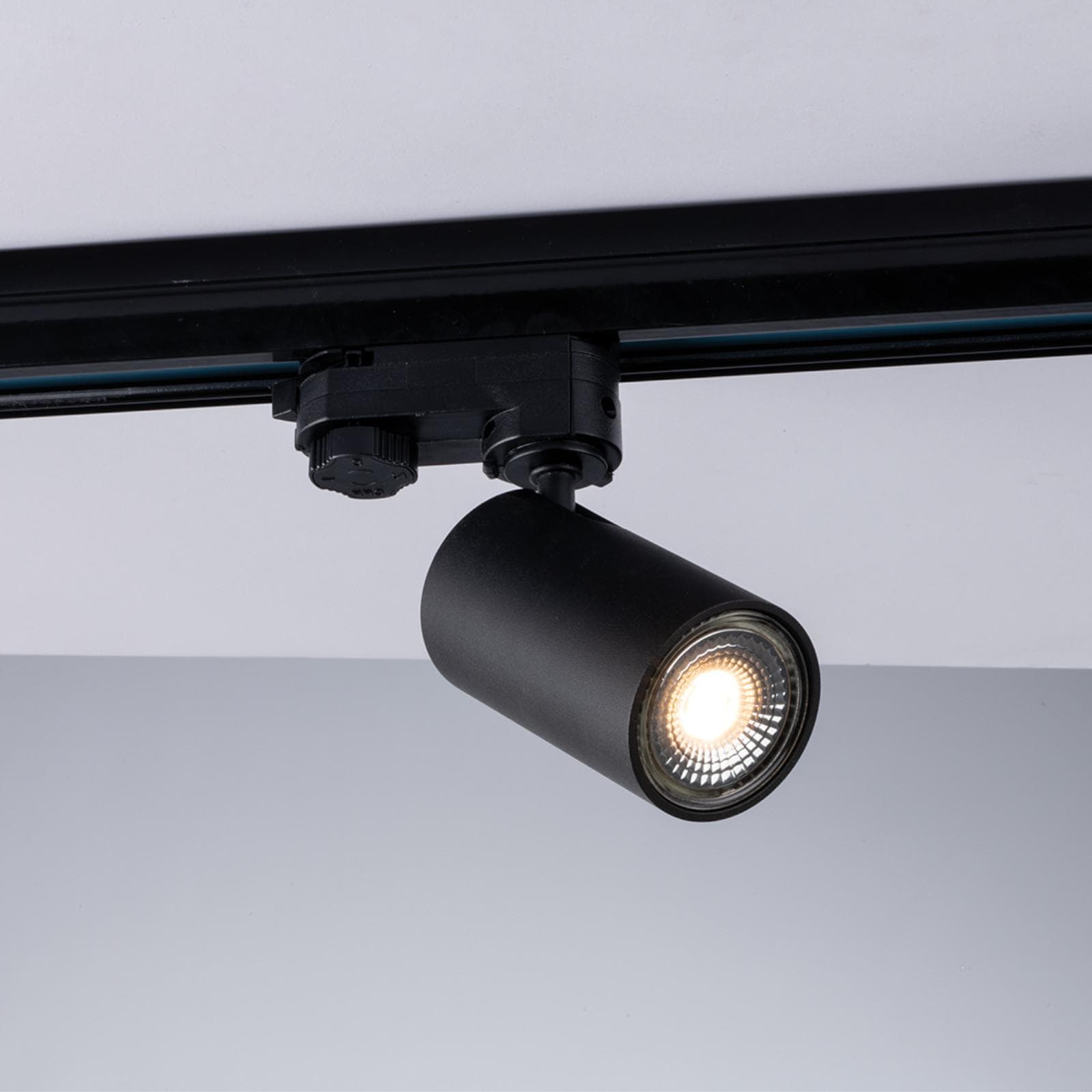 Faro girevole e inclinabile rotondo 6 cm per binario trifase in alluminio nero satinato - Radius