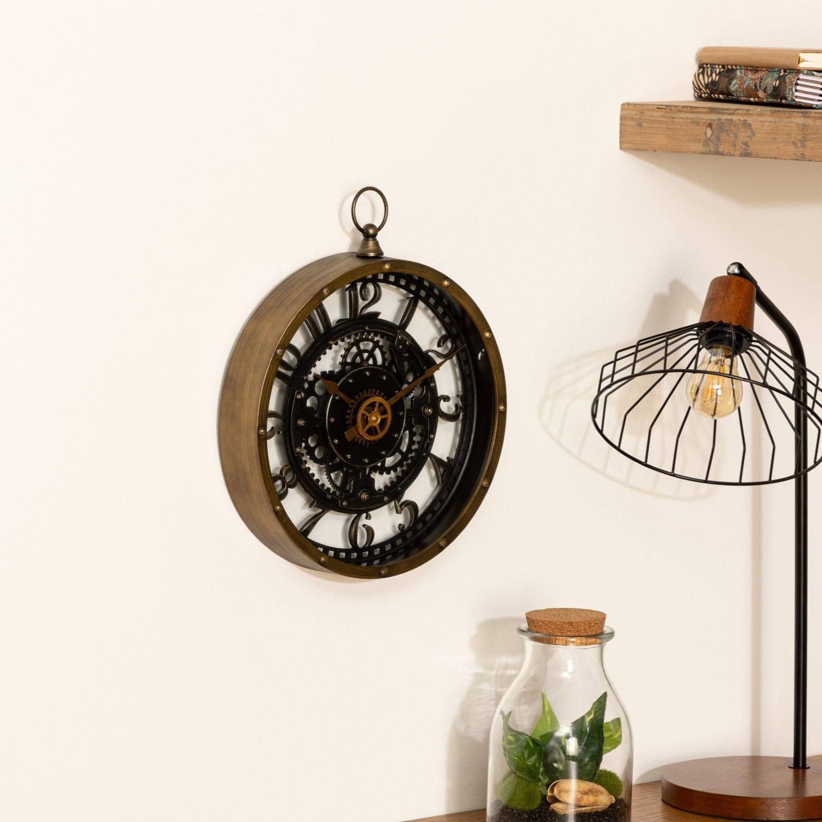 Orologio rotondo 27 cm effetto metallo anticato oro e nero