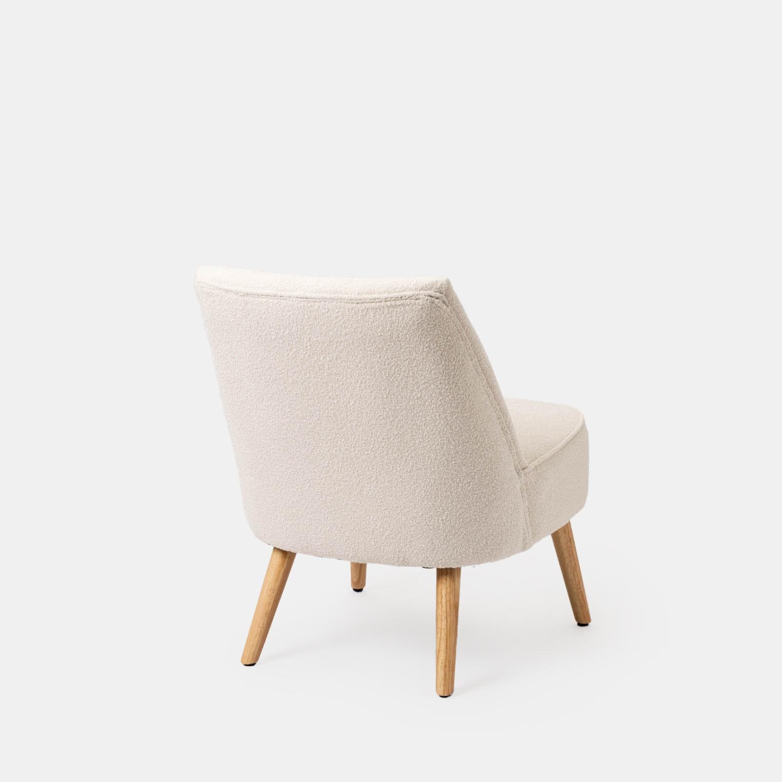 Poltrona in bouclé crema con gambe in legno - Dirla