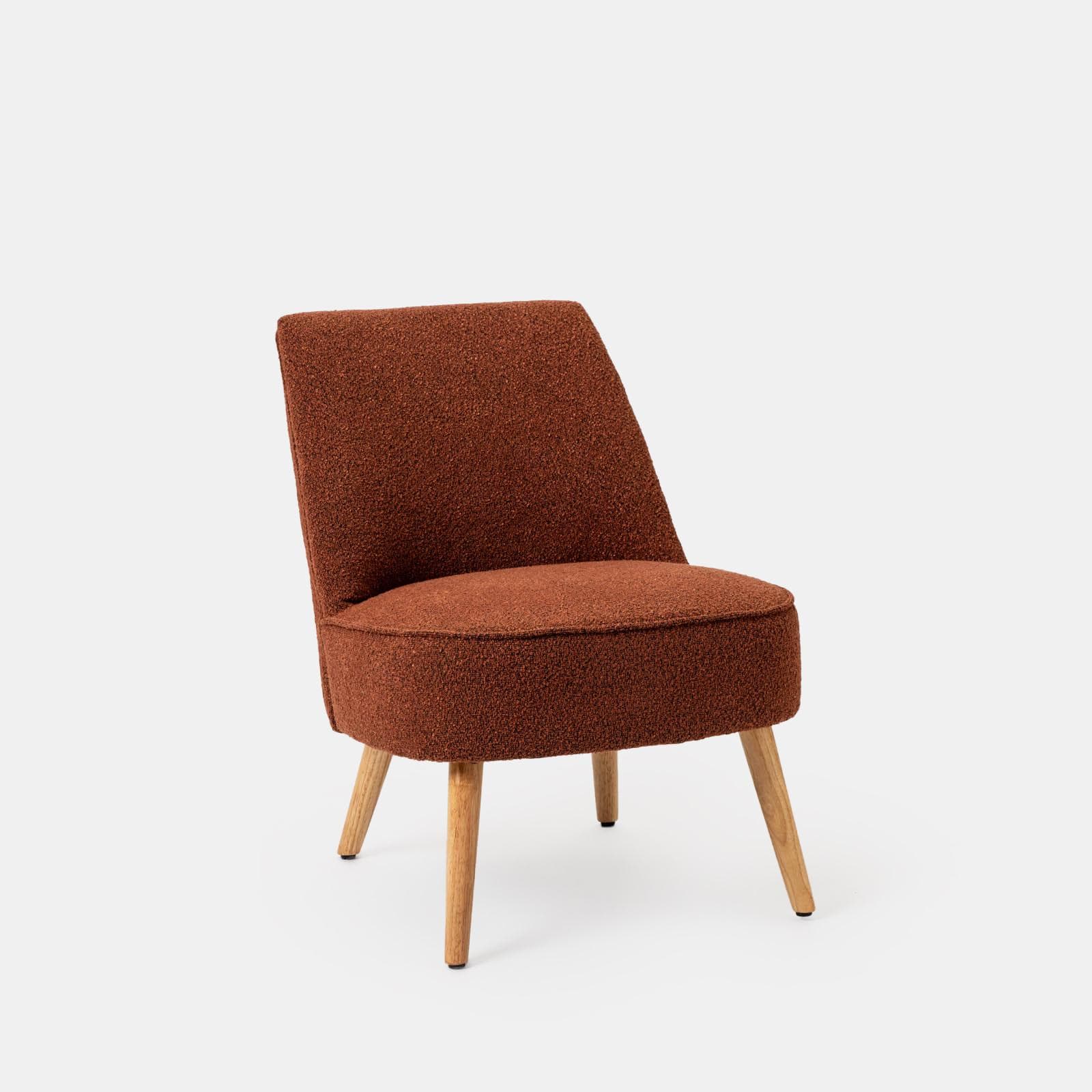 Poltrona in bouclé terracotta con gambe in legno - Dirla