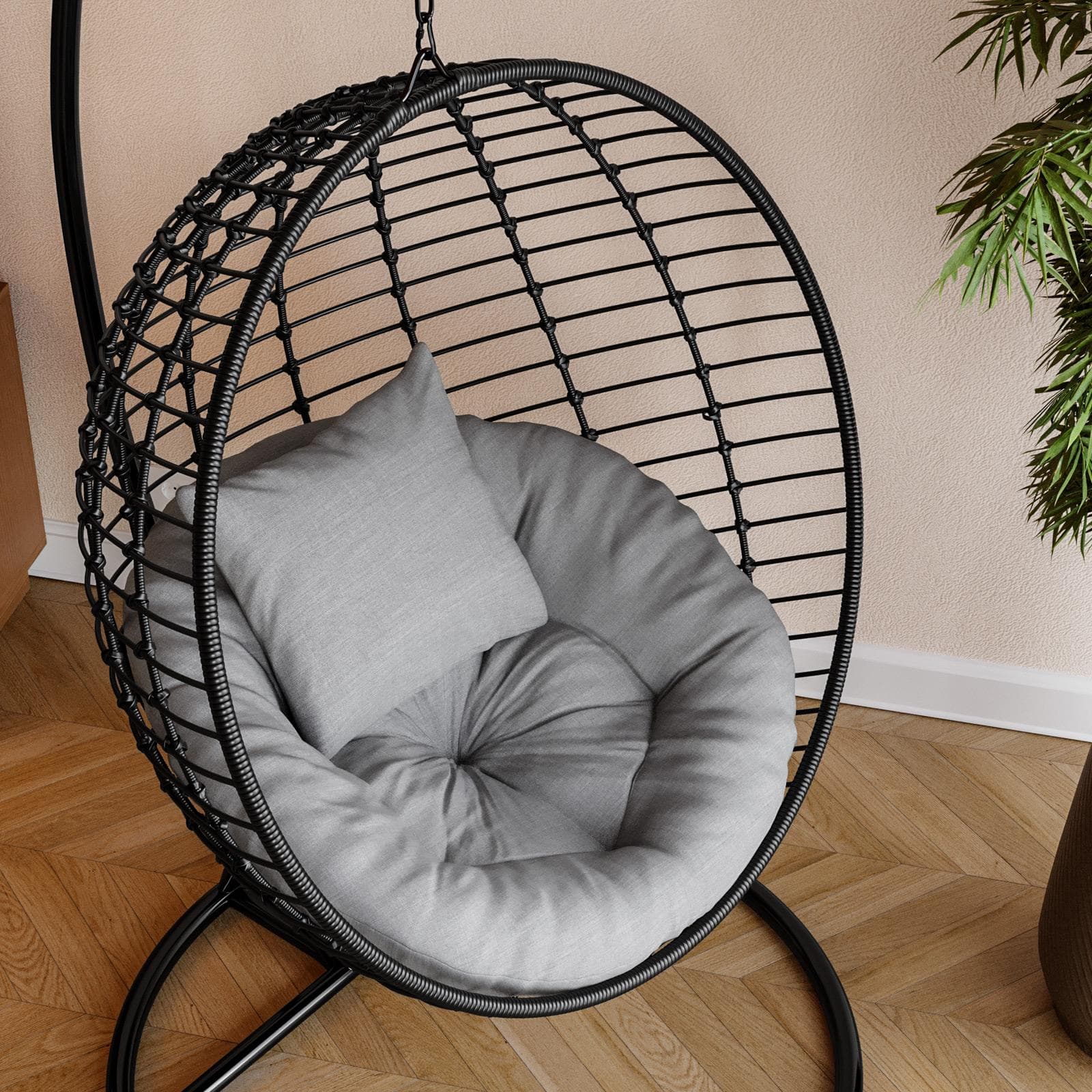 Poltrona sospesa in acciaio e polyrattan nero con cuscini grigi - Strobo