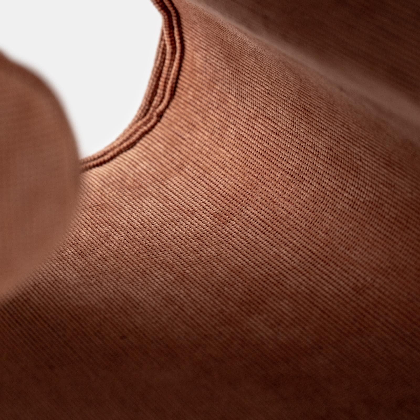 Pouf 45x42 cm in tessuto a trama sottile terracotta con design astratto - Everett