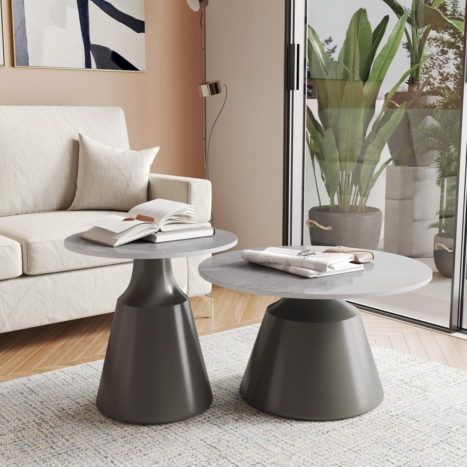 Set 2 tavolini tondi 50 e 70 cm in ceramica grigio scuro effetto marmo e base in metallo grigio - Mikado