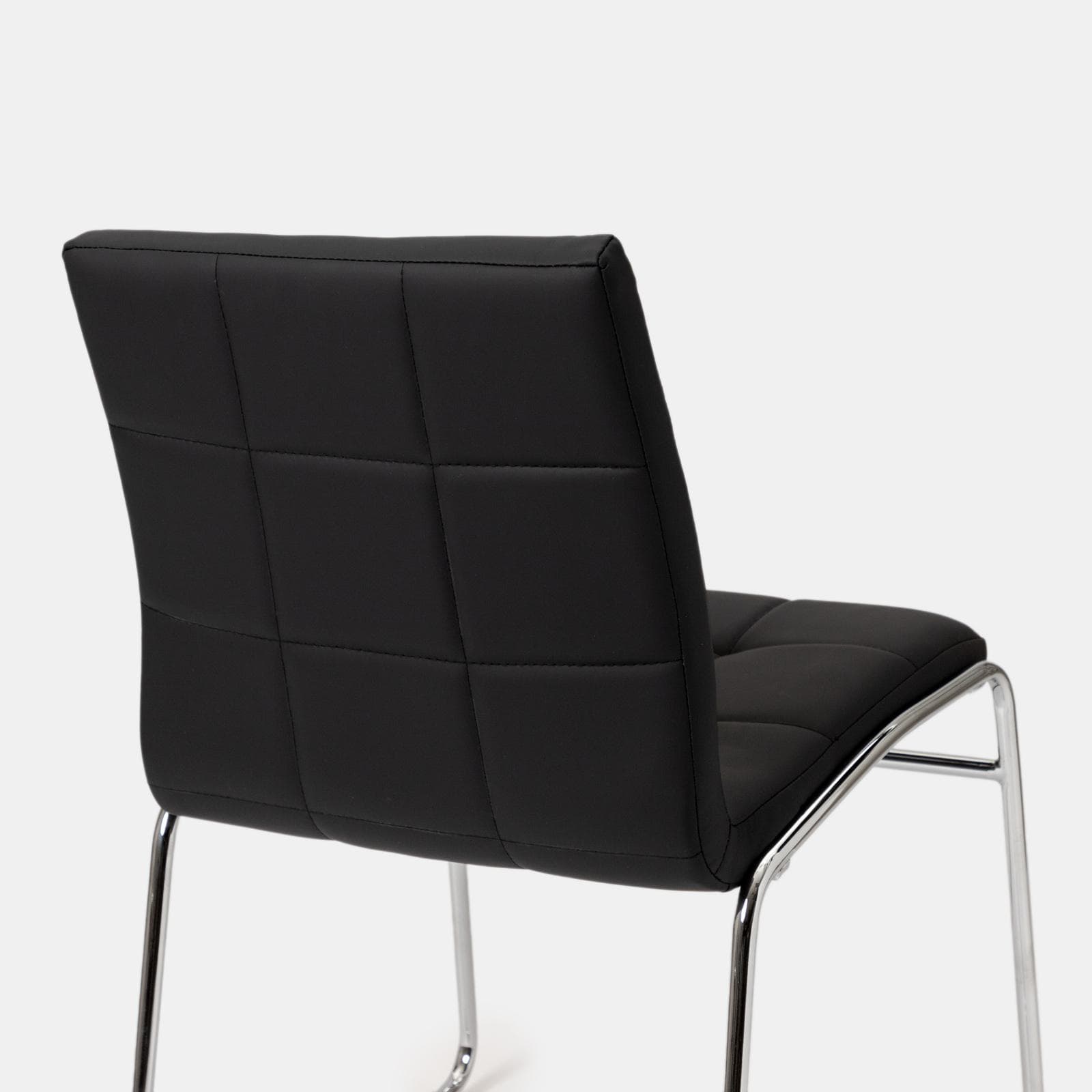 Set 4 sedie in similpelle nera con gambe a slitta cromo - Dilez